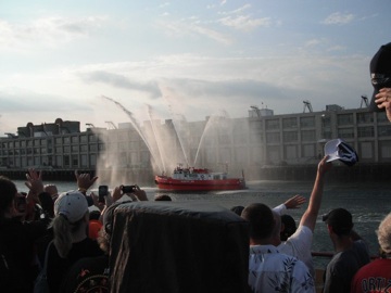 The heroes welcome from the Boston Fireboat.